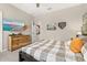 Tastefully decorated bedroom with wall décor, a ceiling fan, a black bedframe, and gray carpeting at 1113 Fieldstone Cir, Oviedo, FL 32765