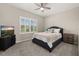 Bedroom showcasing a window with white shutters, a ceiling fan, carpeted floors and calming decor at 1113 Fieldstone Cir, Oviedo, FL 32765
