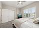 Bedroom featuring plantation shutters, closet with sliding doors, plush carpeting, and serene decor at 1113 Fieldstone Cir, Oviedo, FL 32765