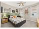 Beautifully decorated bedroom with wainscoting, curtains, a ceiling fan, and windows for natural light at 1113 Fieldstone Cir, Oviedo, FL 32765