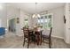 Cozy dining area with natural light, slider door, and wood-look floors at 1113 Fieldstone Cir, Oviedo, FL 32765