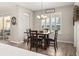 Charming dining area featuring wood table, four chairs, and plantation shutters for natural light at 1113 Fieldstone Cir, Oviedo, FL 32765