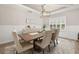 Bright dining area showcasing a coffered ceiling, a large wood table, and stylish seating at 1113 Fieldstone Cir, Oviedo, FL 32765