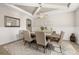 Formal dining room boasts a coffered ceiling and a dark wood table with seating for six at 1113 Fieldstone Cir, Oviedo, FL 32765
