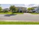 Charming two-story home featuring manicured lawn, a paved driveway, and a two-car garage at 1113 Fieldstone Cir, Oviedo, FL 32765
