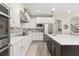 Bright, spacious kitchen featuring stainless steel appliances and modern white cabinetry at 1113 Fieldstone Cir, Oviedo, FL 32765
