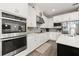 Modern kitchen featuring white cabinets, stainless appliances, and plenty of counter space at 1113 Fieldstone Cir, Oviedo, FL 32765