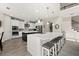 Spacious kitchen featuring a large island with seating, stainless steel appliances, and open access to other rooms at 1113 Fieldstone Cir, Oviedo, FL 32765