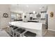 Open kitchen with a large island, white cabinets, and stainless steel appliances at 1113 Fieldstone Cir, Oviedo, FL 32765