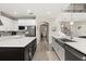 Gourmet kitchen featuring stainless appliances, a breakfast bar, and an open floorplan at 1113 Fieldstone Cir, Oviedo, FL 32765