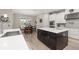 This bright kitchen features stainless steel appliances, an island, and modern lighting at 1113 Fieldstone Cir, Oviedo, FL 32765