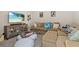 Comfortable living room features a plush sofa, stylish furniture, and a large television for entertainment at 1113 Fieldstone Cir, Oviedo, FL 32765