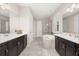The main bathroom has double sinks, tile floors, a soaking tub, and a separate shower at 1113 Fieldstone Cir, Oviedo, FL 32765