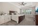 Spacious main bedroom with tray ceiling, ceiling fan, neutral carpet and lots of natural light at 1113 Fieldstone Cir, Oviedo, FL 32765