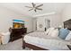 Spacious main bedroom featuring a large TV, dresser, and comfortable furniture, perfect for relaxing at 1113 Fieldstone Cir, Oviedo, FL 32765