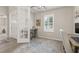 Home office showcasing a workstation near window with natural light and french doors at 1113 Fieldstone Cir, Oviedo, FL 32765