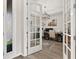 Home office featuring French doors, wood floors, and stylish decor at 1113 Fieldstone Cir, Oviedo, FL 32765