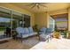 Charming patio with stylish furniture, providing an inviting outdoor living space for relaxation and entertainment at 1113 Fieldstone Cir, Oviedo, FL 32765