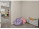 Open playroom featuring beanbag chairs and a bookcase, open to the other side of the playroom at 1113 Fieldstone Cir, Oviedo, FL 32765