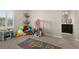 Bright playroom featuring a hopscotch rug and plenty of space for toys, games and activities at 1113 Fieldstone Cir, Oviedo, FL 32765