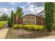 Community sign for The Retreat at Lake Charm, surrounded by lush landscaping and manicured greenery at 1113 Fieldstone Cir, Oviedo, FL 32765