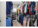 Organized walk-in closet with ample storage, shelving, and hanging space for clothes and accessories at 1113 Fieldstone Cir, Oviedo, FL 32765