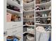 Organized walk-in closet featuring shelves, drawers, and ample storage space for shoes, clothes, and accessories at 1113 Fieldstone Cir, Oviedo, FL 32765