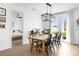 Dining area featuring a wooden table with black chairs and lots of natural light at 1203 Pearl Tree Rd, Deltona, FL 32725