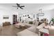 Spacious living room showcasing a modern open-concept layout with sleek furniture and decor at 1203 Pearl Tree Rd, Deltona, FL 32725
