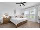 Cozy main bedroom with neutral tones, a comfortable bed, and bright windows at 1203 Pearl Tree Rd, Deltona, FL 32725