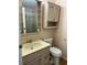 This bathroom features essential amenities, including a sink with vanity storage, a toilet, and a shower for daily convenience at 125 Darlene Ct, Davenport, FL 33897
