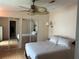 The bedroom features carpeted floors, a ceiling fan, and a closet with mirrored doors at 125 Darlene Ct, Davenport, FL 33897