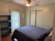 The cozy bedroom with a comfortable queen-sized bed and a large window offers a peaceful and restful retreat at 125 Darlene Ct, Davenport, FL 33897