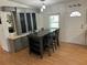This dining area features an elegant table set with an adjacent storage and mirrored bar, providing a stylish and functional space at 125 Darlene Ct, Davenport, FL 33897