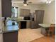 This kitchen features stainless steel appliances, a breakfast bar, and modern cabinets at 125 Darlene Ct, Davenport, FL 33897