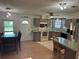 A bright kitchen offers stainless steel appliances, eat-in counter, and a window over the sink at 125 Darlene Ct, Davenport, FL 33897