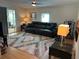 The cozy living room offers an outdoor view and comfortable seating with a decorative rug at 125 Darlene Ct, Davenport, FL 33897
