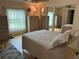 The main bedroom features a queen-sized bed, ample closet space, and a window for natural light, creating a relaxing environment at 125 Darlene Ct, Davenport, FL 33897