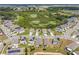 An aerial view of a neighborhood with ponds and well-maintained lawns at 129 Eagleview Loop, Davenport, FL 33837