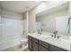 Primary bathroom features double sinks, tub and walk-in shower at 129 Eagleview Loop, Davenport, FL 33837