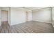 A spacious bedroom featuring modern flooring, neutral walls, and abundant natural light at 129 Eagleview Loop, Davenport, FL 33837