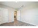 Bedroom with two closets and wood-look floors at 129 Eagleview Loop, Davenport, FL 33837