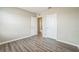 Bedroom with two closets and wood-look floors at 129 Eagleview Loop, Davenport, FL 33837