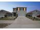 Charming two-story home with a two-car garage and well-maintained front yard at 129 Eagleview Loop, Davenport, FL 33837