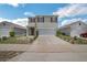 Charming two-story home with a two-car garage and well-maintained front yard at 129 Eagleview Loop, Davenport, FL 33837