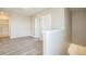 Bright hallway features wood-look flooring and white trim at 129 Eagleview Loop, Davenport, FL 33837