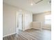 Bright hallway features wood-look flooring and natural light at 129 Eagleview Loop, Davenport, FL 33837