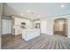 Bright kitchen features white cabinetry, stainless appliances, and a large center island at 129 Eagleview Loop, Davenport, FL 33837