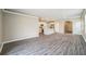 Open-concept living room showcasing a view into the adjacent kitchen at 129 Eagleview Loop, Davenport, FL 33837