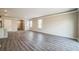 Bright living room featuring modern flooring and large windows for ample natural light at 129 Eagleview Loop, Davenport, FL 33837